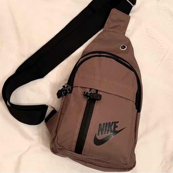 Nike Handbags - NWT Nike Sling Bag Backpack Carry On Shoulder School Bag Mauve Purple
